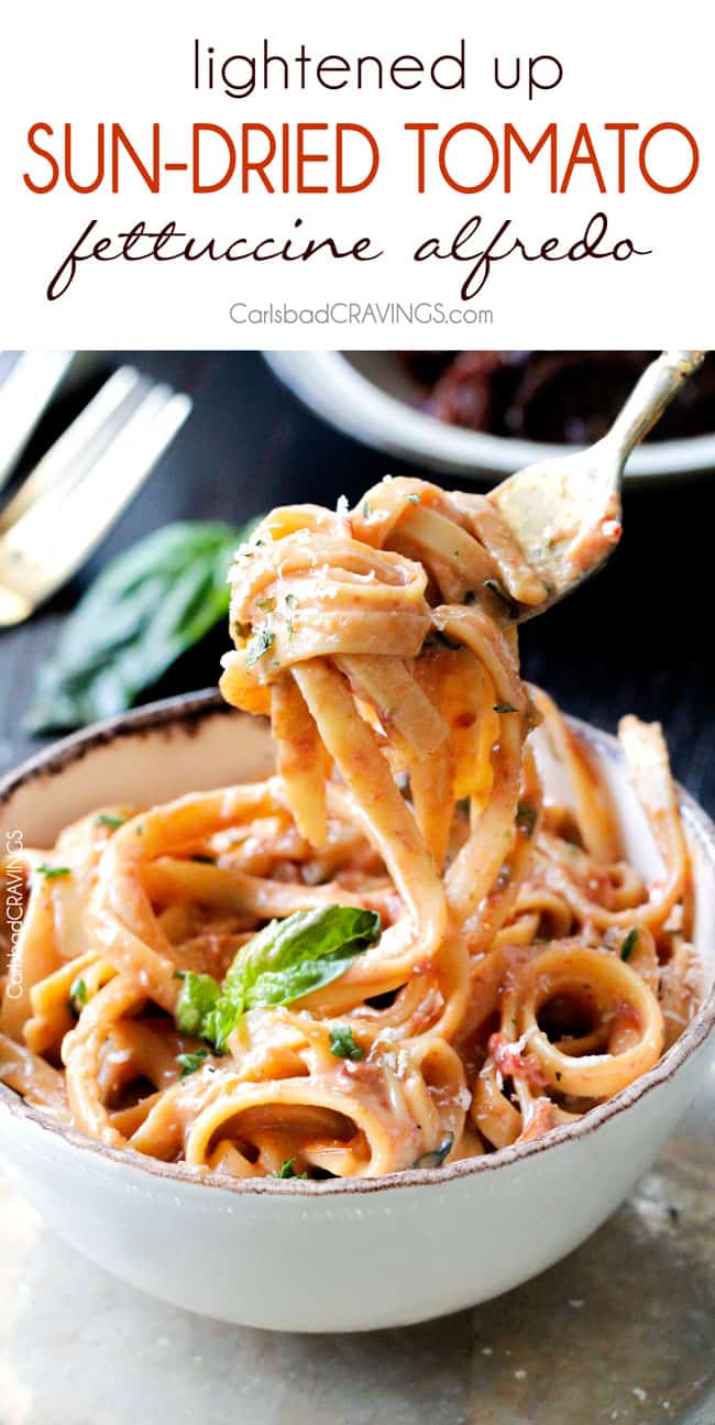 Sun-dried Tomato Fettuccine Alfredo on a fork.