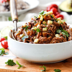 Slow Cooker Sweet and Spicy (optional) Pineapple Salsa Pork - crazy good EASY, flavorful filling for burritos, tacos, burrito bowls, salads, etc. I love making this for company because its SO good and SO easy!