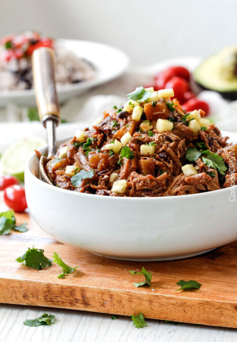 Slow Cooker Sweet and Spicy (optional) Pineapple Salsa Pork - crazy good EASY, flavorful filling for burritos, tacos, burrito bowls, salads, etc. I love making this for company because its SO good and SO easy!