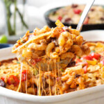 LIGHTER Cheesy Taco Pasta is my husband's absolute favorite pasta! Juicy beef, beans, pasta etc., smothered in an incredible Mexican spiced sauce is out of this world delicious! Your whole family will LOVE this and its super easy!