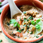 Slow Cooker Thai Coconut Chicken Wild Rice Soup loaded with customizable veggies in a creamy red curry peanut butter coconut broth is out is out of this world Delicious and couldn't be any easier!