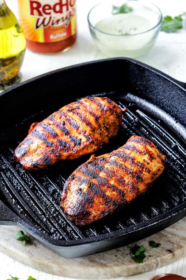 Showing How to Make Buffalo Chicken Recipe by grilling chicken on indoor grill pan