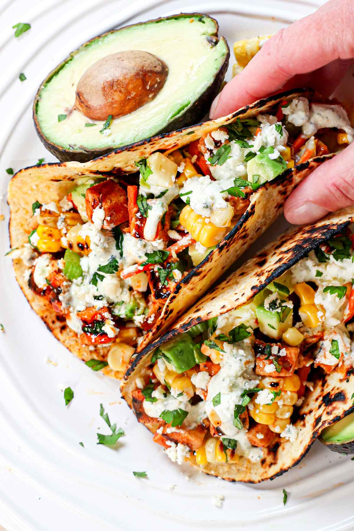 top view of picking up a buffalo chicken taco