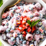 Fresh Berry Salad is one of the BEST fruit salads you will ever make! Smothered in sweet and tangy, incredibly creamy Honey Mascarpone that takes minutes to whip up and tastes incredible! Perfect for brunch, barbecues and all your pool side parties!