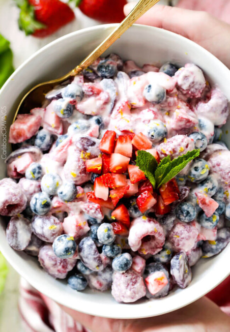 Fresh Berry Salad is one of the BEST fruit salads you will ever make! Smothered in sweet and tangy, incredibly creamy Honey Mascarpone that takes minutes to whip up and tastes incredible! Perfect for brunch, barbecues and all your pool side parties!