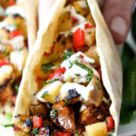 Teriyaki Chicken Tacos smothered with the BEST easy teriyaki sauce and piled with Grilled Pineapple Pear Salsa will be your new favorite taco! Company worthy but everyday easy!