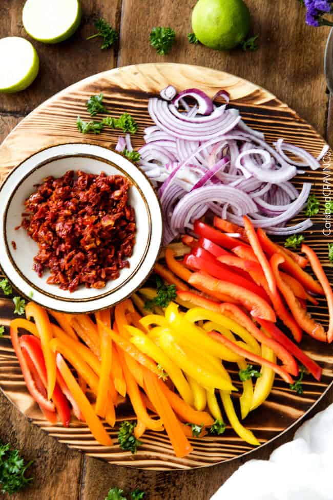 overhead view of ingredients needed for cajun chicken pasta alfredo.