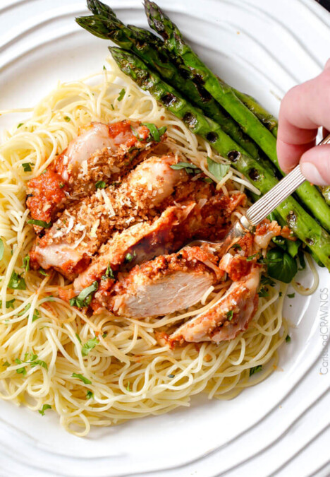 My whole family loves this Skinny Chicken Parmesan! Its packed with flavor and so much EASIER than breading each chicken piece! I will never make "traditional" Chicken Parmesan again