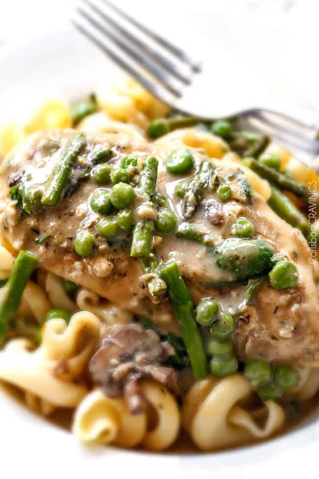 Creamy Parmesan Pesto Chicken Skillet - this is the BEST one skillet Chicken! the chicken is rubbed in pesto/Parmesan for amazing flavor and the sauce is the creamiest, most flavorful, all done in 30 minutes! I love mine with pasta, my husband loves his with potatoes! 