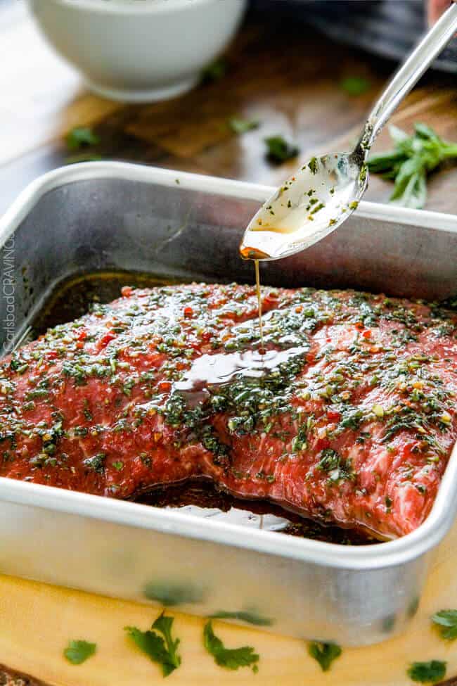 Showing how to make Grilled Asian Steak by marinading the steak adding Chimichurri sauce.