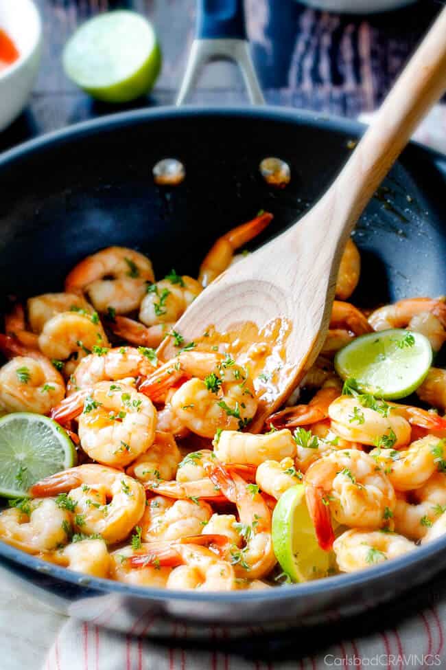 Sweet Chili Shrimp with lime garnish in a pan.
