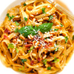 Creamy Butternut Squash Pasta - silky quick and easy pasta that is SO creamy and absolutely addicting! Infused with fresh Parmesan, seasoned to perfection and topped with crispy bacon and toasted pine nuts! #glutenfree #fall