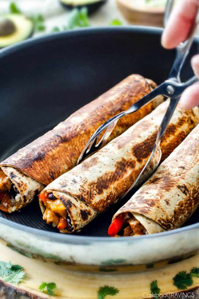 Showing Chicken Fajita Wraps being cooked in a pan.
