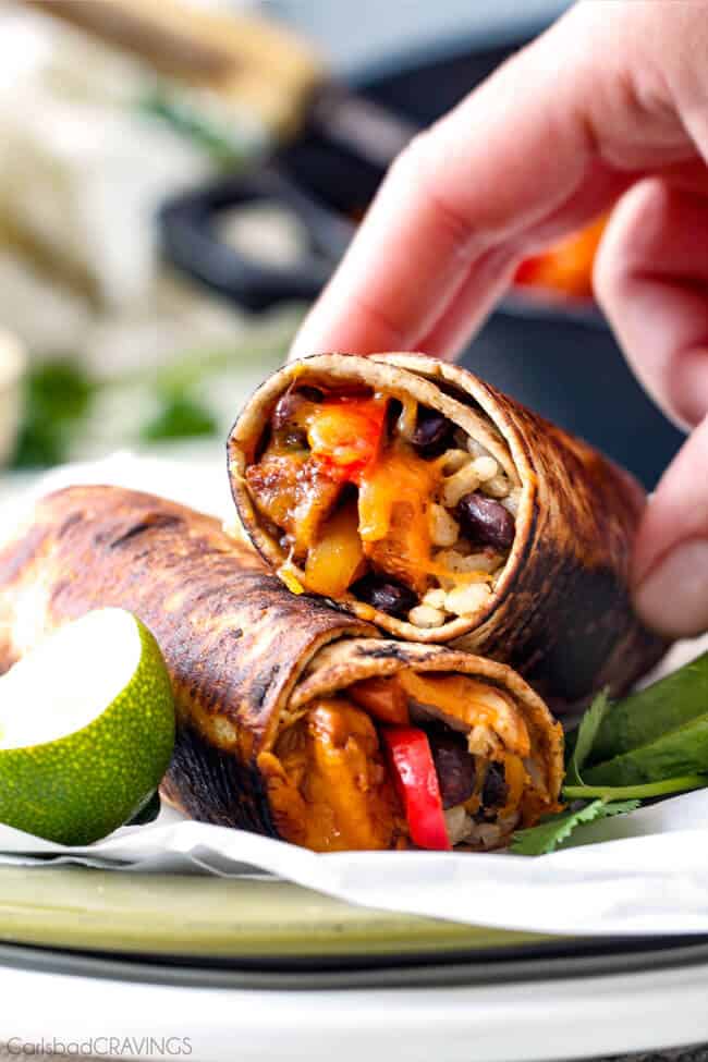 Two Chicken Fajita Wraps on a plate.