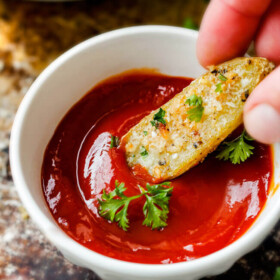 Easy baked Parmesan Fingerling Potato Fries with a crispy exterior and creamy buttery interior make the perfect appetizer, snack or side you won't be able to stop munching!