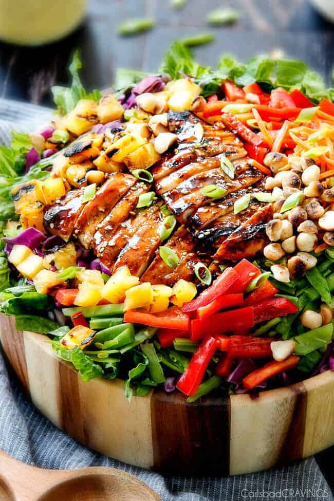 Teriyaki Chicken Salad with Pineapple Sesame Dressing with nuts and green onion.