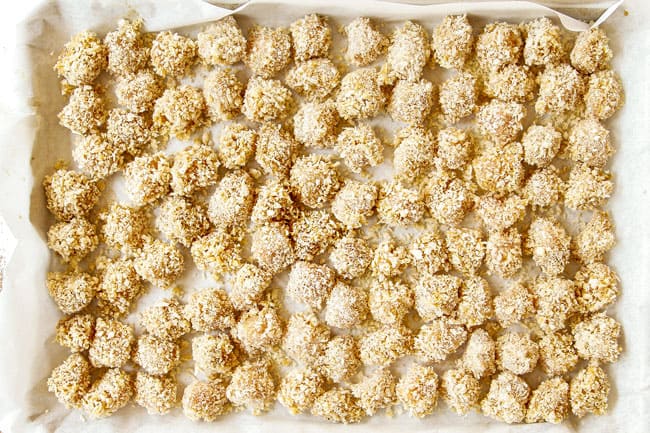 showing how to make Chinese Lemon Chicken by adding coating chicken in panko breadcrumbs and lining on a parchment lined baking sheet