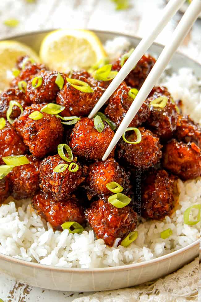 picking up Crispy Chinese Lemon Chicken with chopsticks