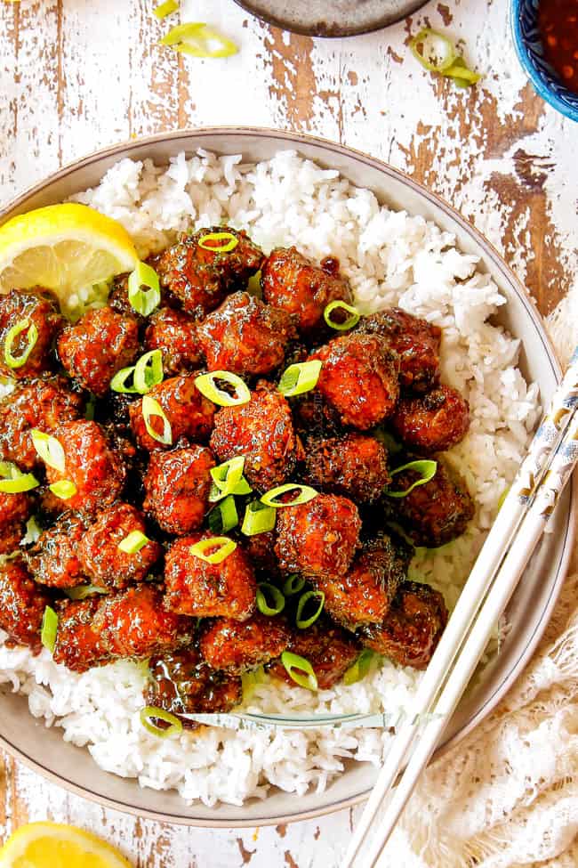 Top view of Crispy Chinese Lemon Chicken with green onion on top.
