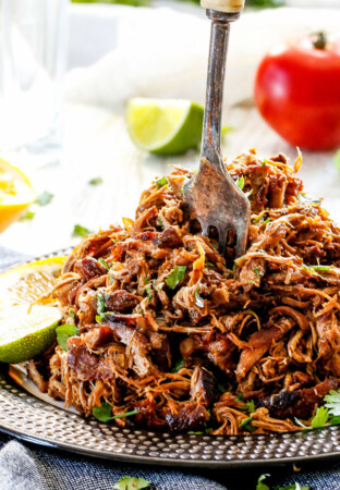 these are the BEST Pork Carnitas (Slow Cooker Mexican Pulled Pork) I have ever tried! Super juicy, easy and so much more flavorful than other versions I've tried and the crispy burnt ends are the best! Great for large crowds and for tacos, burritos, or nachos!