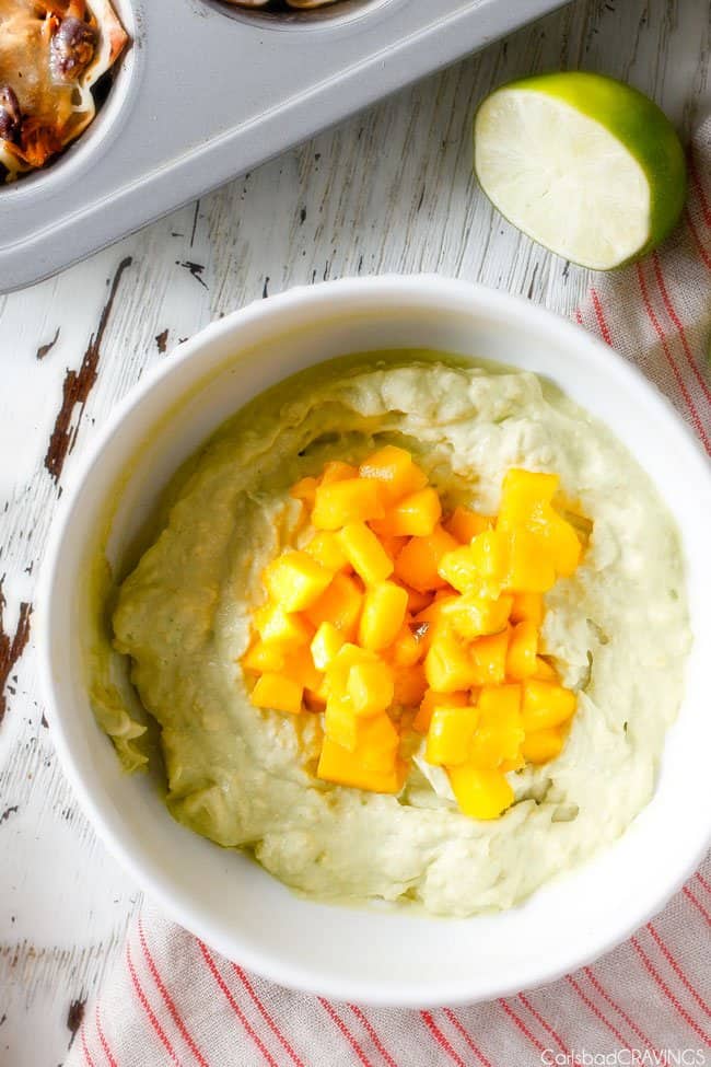 Showing how to make the Salsa Verde Honey Lime Chicken Taco Cups by making the mango cream sauce.