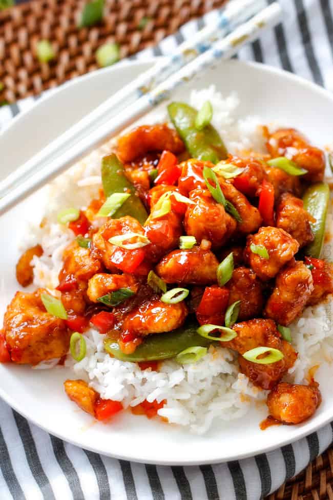 Hoisin Chicken Stir Fry - my family went crazy over this chicken and gobbled it up in minutes! So many layers of flavor - definitely some of the best fakeout takeout I've ever tried! Definitely a keeper! top view of hoisin chicken with rice on a white plate