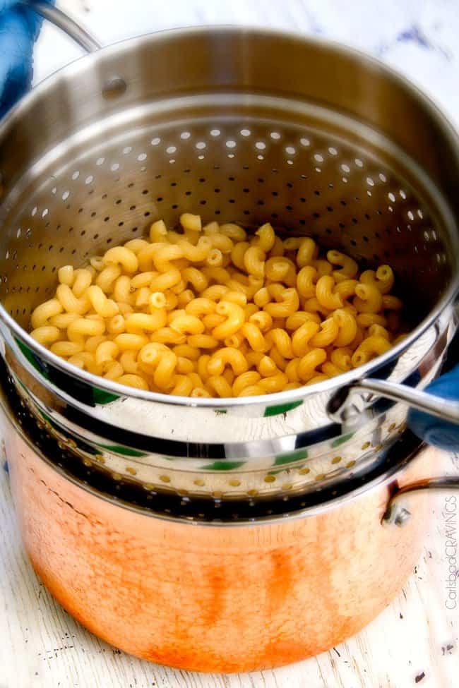 This mega creamy (lightened up) Salsa Verde Pepper Jack Macaroni and Cheese is crazy flavorful infused with salsa verde, pepper jack and sharp cheddar and super easy to make! A new family favorite on the table in under 30 minutes (including the option of chicken and veggies)!