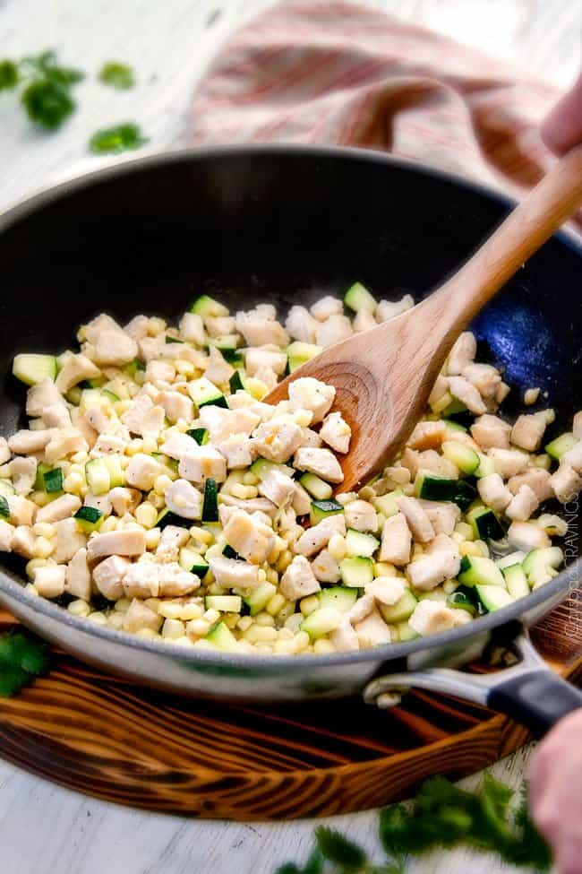 This mega creamy (lightened up) Salsa Verde Pepper Jack Macaroni and Cheese is crazy flavorful infused with salsa verde, pepper jack and sharp cheddar and super easy to make! A new family favorite on the table in under 30 minutes (including the option of chicken and veggies)!