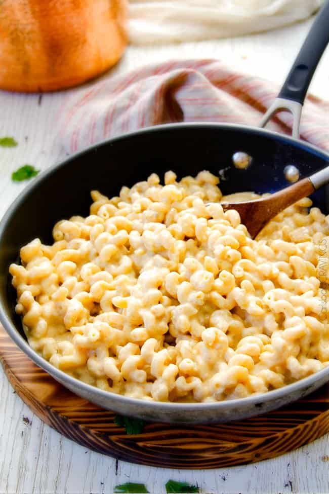 This mega creamy (lightened up) Salsa Verde Pepper Jack Macaroni and Cheese is crazy flavorful infused with salsa verde, pepper jack and sharp cheddar and super easy to make! A new family favorite on the table in under 30 minutes (including the option of chicken and veggies)!
