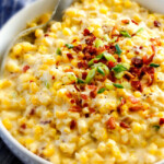 Slow Cooker Creamed Corn with Ricotta and Bacon - this has to be the BEST CREAMED CORN I've eaten in my entire life! Rich and creamy, seasoned to perfection, SO easy and practically fool proof! Definitely making this every Thanksgiving from now on!