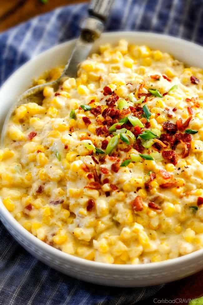 Slow Cooker Creamed Corn with Ricotta and Bacon - this has to be the BEST CREAMED CORN I've eaten in my entire life! Rich and creamy, seasoned to perfection, SO easy and practically fool proof! Definitely making this every Thanksgiving from now on!