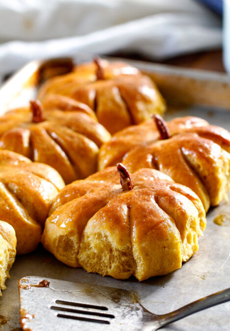 Fluffy, soft and tender Pumpkin Rolls will be the talk of your Thanksgiving Table! Adorably delicious and easier than you might think!