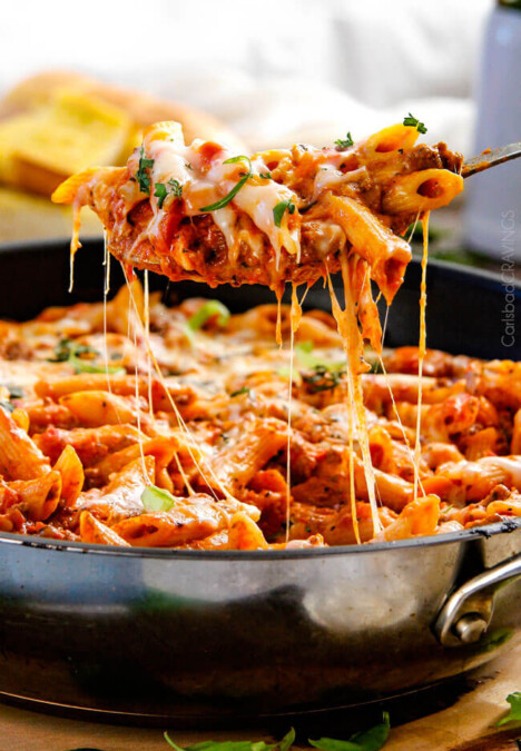 One Skillet Cheesy Penne - the best homemade ragu sauce simmered right with the pasta then loaded with cheese! My family begs me to make this weekly!