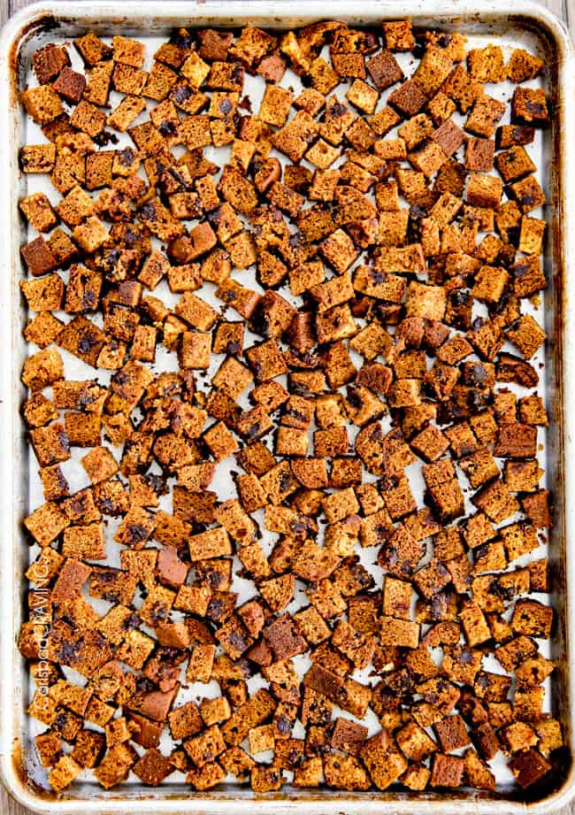 showing how to make pumpkin bread pudding by toasting the pumpkin bread