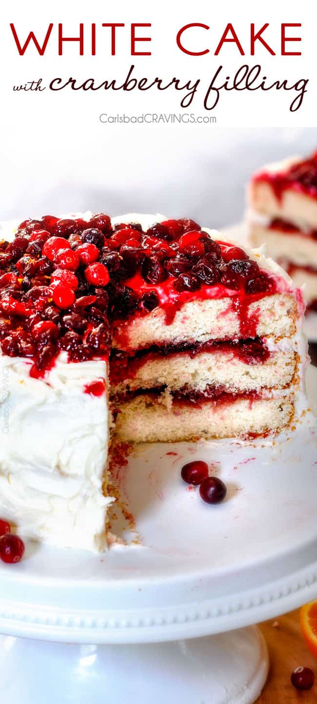 White Cake with Cranberry Filling and Buttercream Frosting – everyone always asks me for this recipe! The moist, bakery style white cake is the BEST ever and the sweet and tangy cranberry filling is melt in your mouth delicious and Christmas festive!