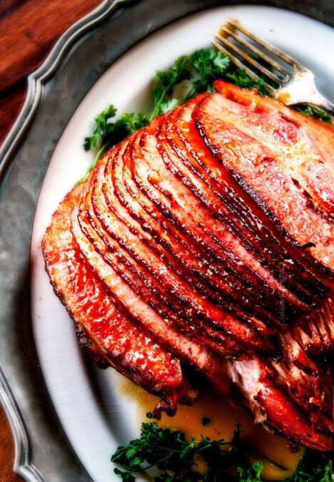 Baked Ham with Apple Cider Maple Glaze: beautifully caramelized, flavorful and deliciously moist baked ham takes minutes to prep and the glaze is out of this world! Perfect for Christmas, Easter and feeds a crowd!