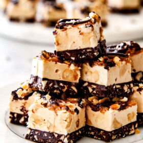 EASY Chocolate Caramel Peanut Butter Fudge with NO boiling and no candy thermometer! I made these for Thanksgiving and they were gone in minutes with everyone begging for the recipe