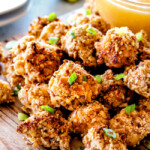 I am in LOVE with these BAKED COCONUT CASHEW CHICKEN BITES with sweet and tangy Pineapple Dip! Sweet and spicy, crunchy outside, tender inside and the flavor combo is dreamy! The BEST appetizer that everyone raves about! You seriously won't be able to stop eating them!
