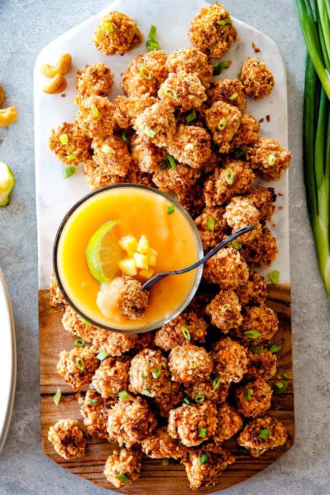 Baked Coconut Cashew Chicken Bites with dipping sauce.