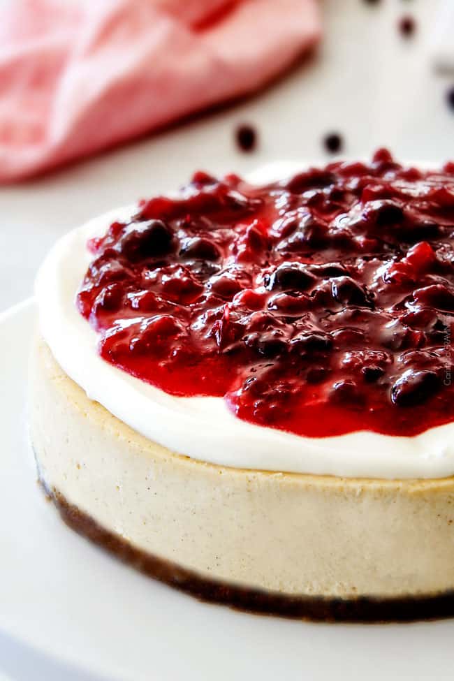 Close of of the top of the cake Cranberry Eggnog Cheesecake.