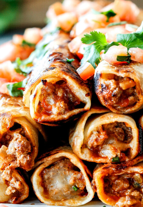 Crispy Jalapeno Popper Beef Taquitos bursting with irresistible creamy, cheesy spicy beef filling (customizable) all cocooned in crispy tortillas and done in less than 30 mintues! These are my husband's favorite ever appetizer and I couldn't stop eating them! Perfect game day any party appetizer!