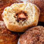 EASY Nutella Stuffed Snickerdoodle Muffins AKA muffins dunked in butter and generously coated in cinnamon-sugar for a baked muffin that tastes like a fried donut AND each stuffed with creamy Nutella! These muffins are super quick to whip up and make the best special occasion breakfasts or dessert (like Christmas!)