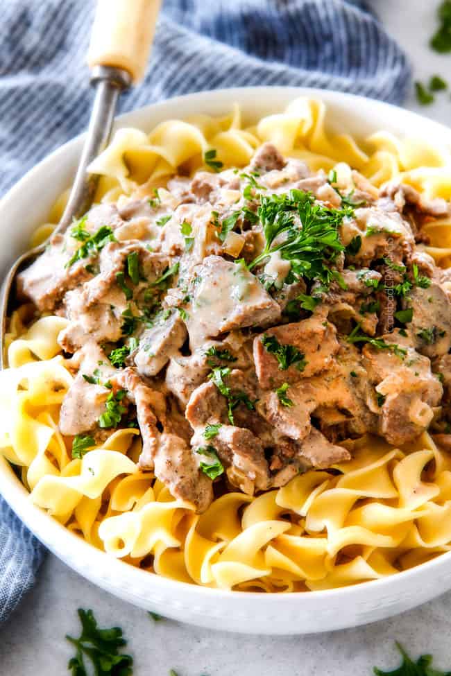 This is by far my family's favorite Slow Cooker Beef Stroganoff recipe! An ultra rich and creamy, amazingly flavorful sauce (without any "cream of" anything!), crazy tender meat all made in the crockpot for a gourmet meal with hardly any effort! I love serving this for holidays like Christmas!