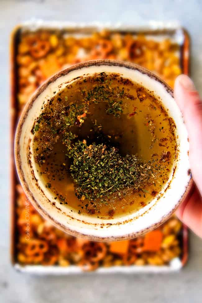 Make ahead crunchy, salty, savory Italian Parmesan Party Mix bursting with Italian flavor in each cashew, pretzel, chex mix bite! This is my go-to party snack that everyone begs me to make!