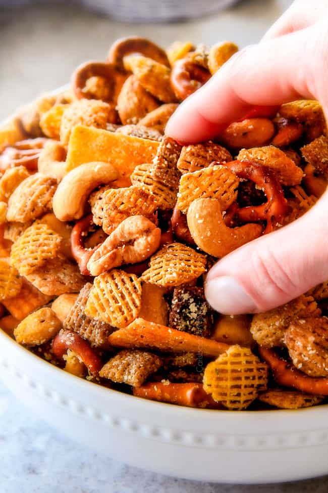 Make ahead crunchy, salty, savory Italian Parmesan Party Mix bursting with Italian flavor in each cashew, pretzel, chex mix bite! This is my go-to party snack that everyone begs me to make!