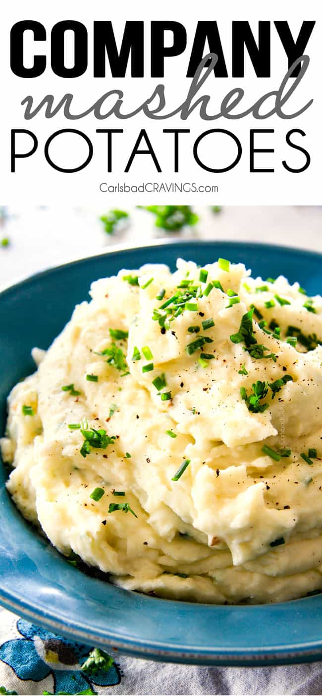 Creamy garlic mashed potatoes in a blue bowl with butter and chivesutter, garlic, and Parmesan! I could eat these all day alone with a spoon - they are incredibly velvety, flavorful and so good everyone will beg you for the recipe!
