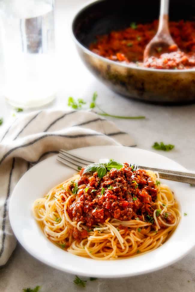 Quick and easy Weeknight Spaghetti Bolognese bursting with flavor on your table in under 30 minutes but tastes like its been simmering all day! We make this recipe more than ANY OTHER RECIPE!