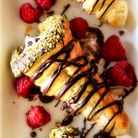 Wonderfully EASY Puff Pastry Cannoli Cones stuffed with dreamy authentic cannoli filling are super impressive yet hardly any effort! Make ahead for your next party!