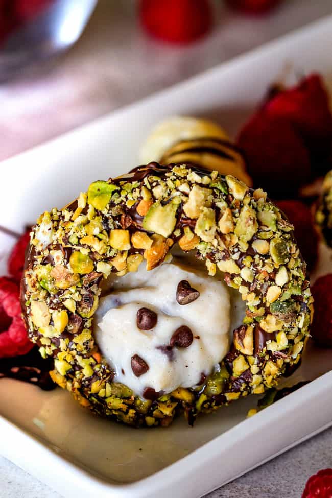 Close up of a Puff Pastry Cannoli Cones with pistachios and chocolate.