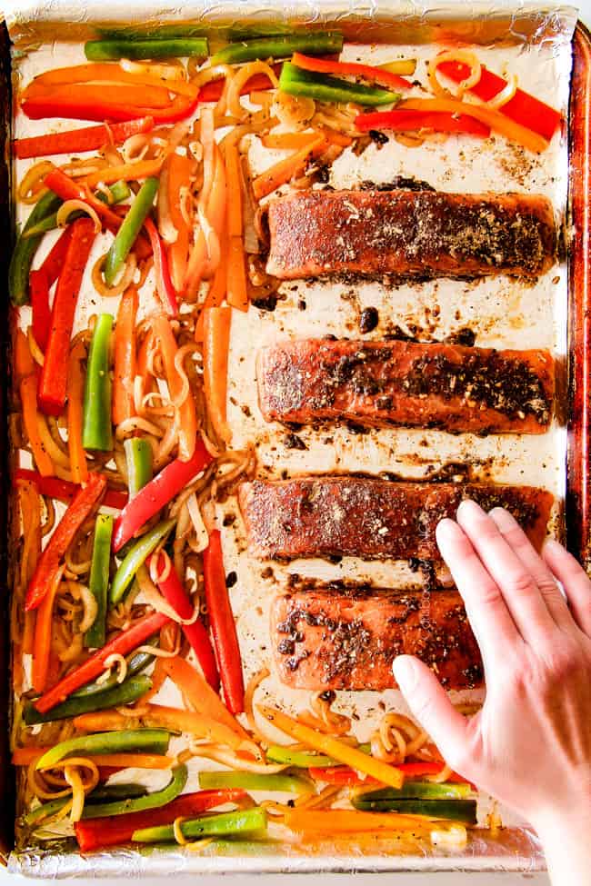 Showing how to make Sheet Pan Fajita Salmon with Cilantro Lime Butter by baking all ingredients on a sheet pan.